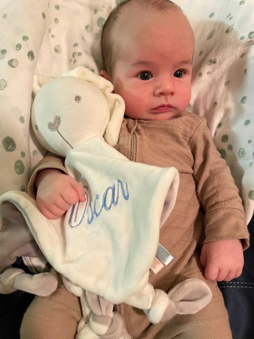 White plush bunny with one big ear and one small ear to teach babies the difference between big and small, personalised with baby's name embroidered in light blue thread.