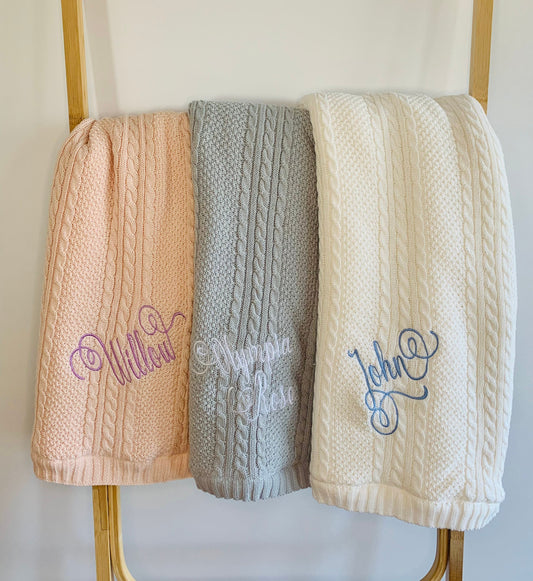 Warm baby blankets, embroidered with baby's name in a delicate swirl font. 