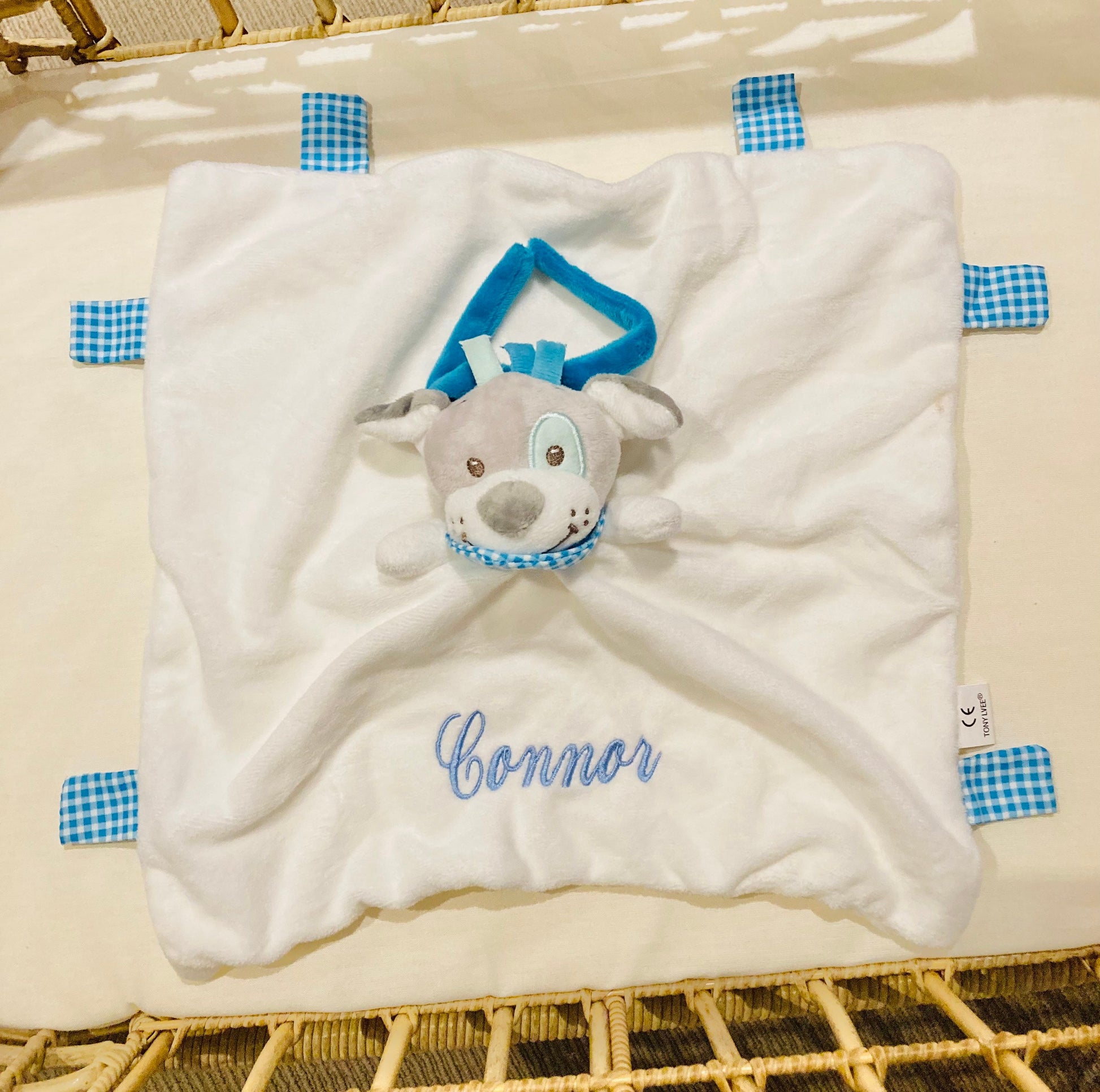 Personalised Dog baby comforter, with baby's name embroidered in blue thread. 